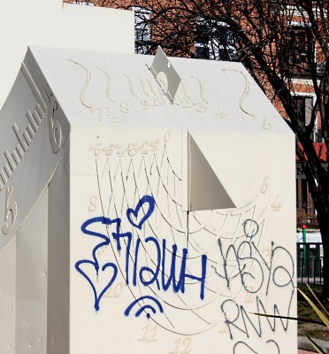 Sundial defaced by graffitis